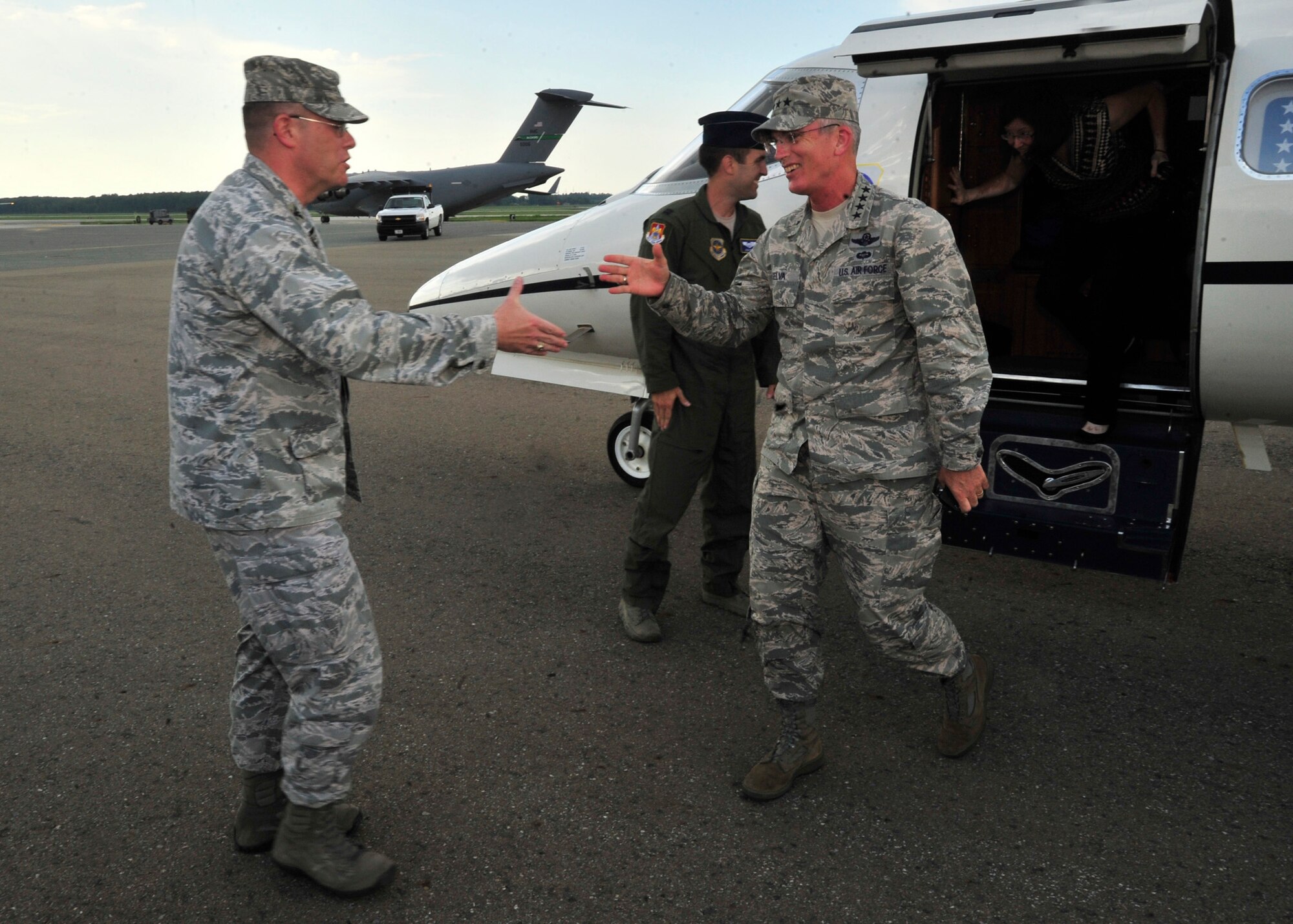 Gen. Paul J. Selva, Air Mobility Command commander, shakes hands with Col. Rick Moore, 436th Airlift Wing commander, July 8, 2013, at the flightline on Dover Air Force Base, Del. Selva arrived at Dover for a two-day tour of the base and to meet Team Dover personnel. (U.S. Air Force photo/Tech. Sgt. Chuck Walker)