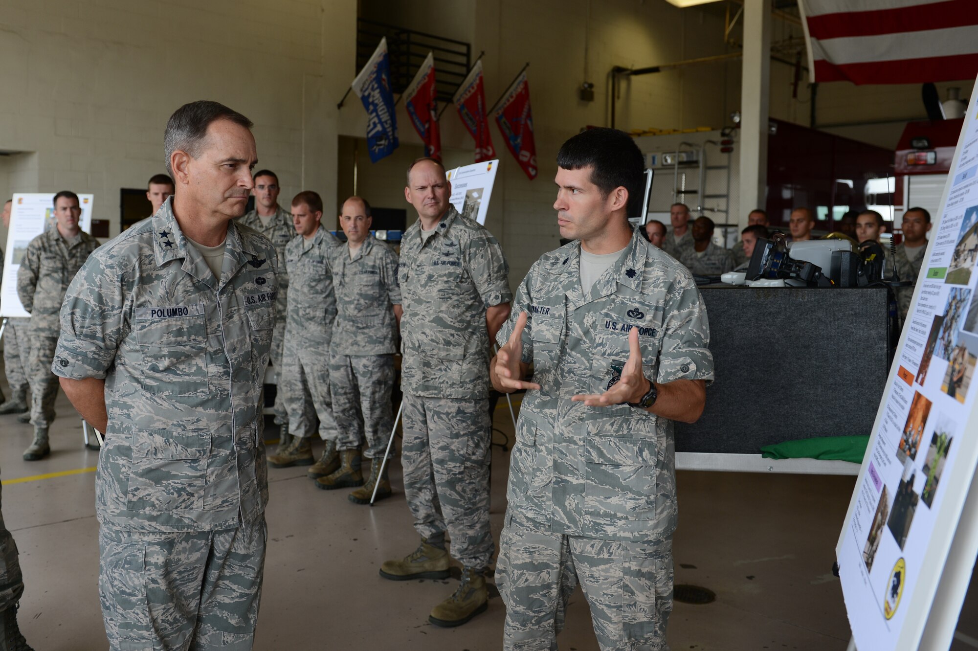 Lt. Col. Terrence Walter, 20th Civil Engineer Squadron commander, briefs Maj. Gen. Jake Polumbo, 9th Air Force commander, about his unit’s mission and capabilities at the fire department at Shaw Air Force Base, S.C., July 1, 2013. Polumbo toured the 20th Fighter Wing and visited multiple units that compose it. (U.S. Air Force photo by Airman 1st Class Krystal M. Jeffers/Released)
