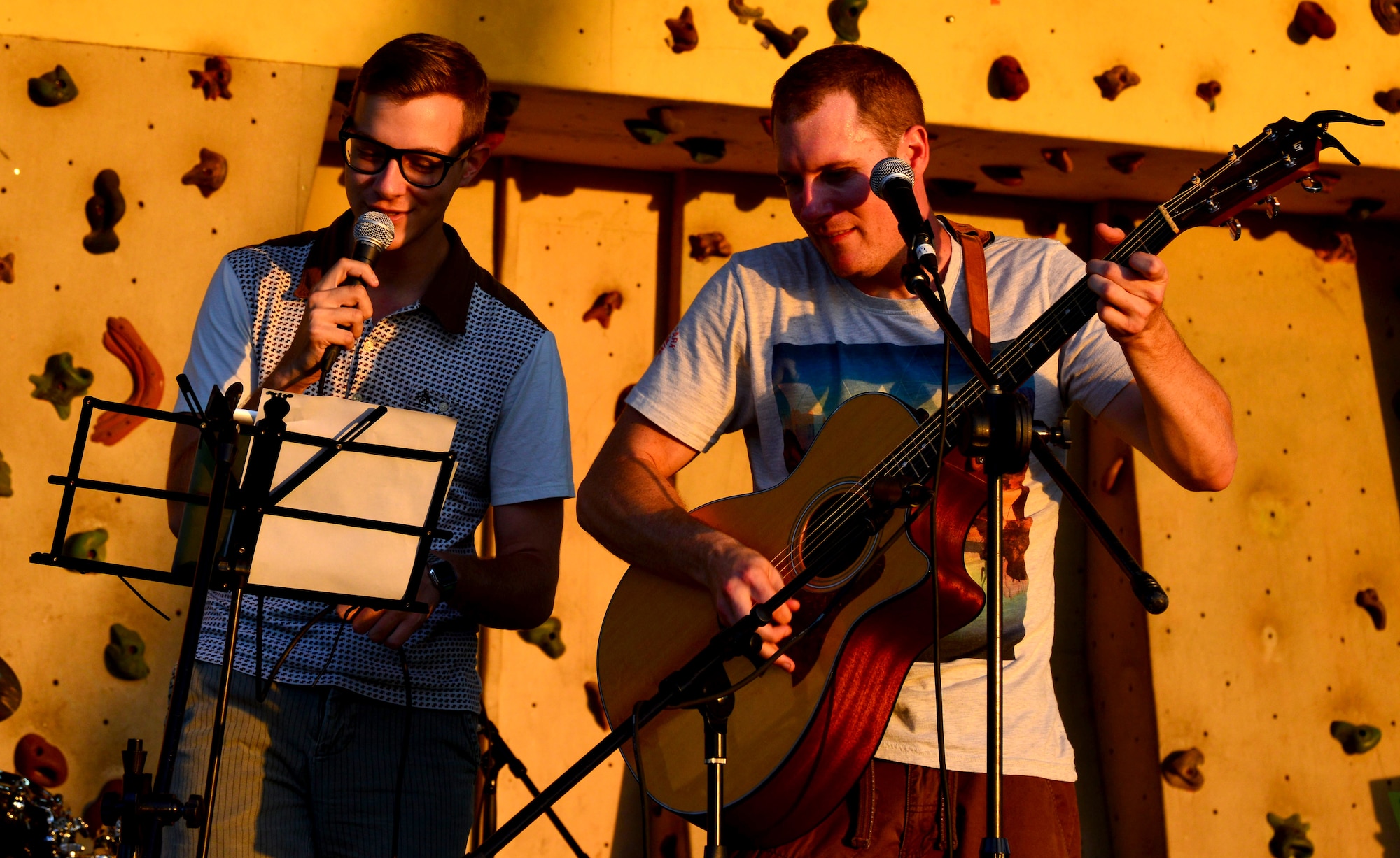 Airman 1st Class Stephen Jarman, American Forces Network - Incirlik, and Staff Sgt. Michael Buchanan, 39th Medical Operations Squadron, perform for members gathered during the Fourth of July celebration July 4, 2013, at Incirlik Air Base, Turkey. Several members of Team Incirlik provided musical performances to help entertain crowd members gathered for the holiday. (U.S. Air Force photo by Staff Sgt. Eric Summers Jr./Released)