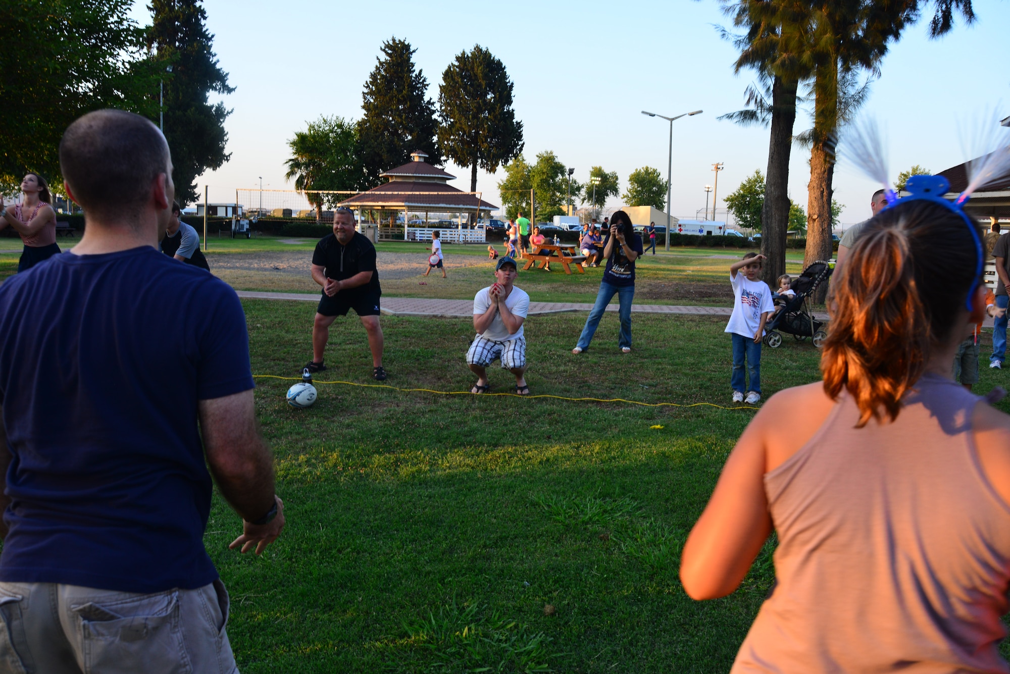 Members of Team Incirlik toss water balloons during the water balloon toss July 4, 2013, at Incirlik Air Base, Turkey. Members of Team Incirlik gathered to enjoy games, food, music and fireworks during the Fourth of July celebration. (U.S. Air Force photo by Staff Sgt. Eric Summers Jr./Released)