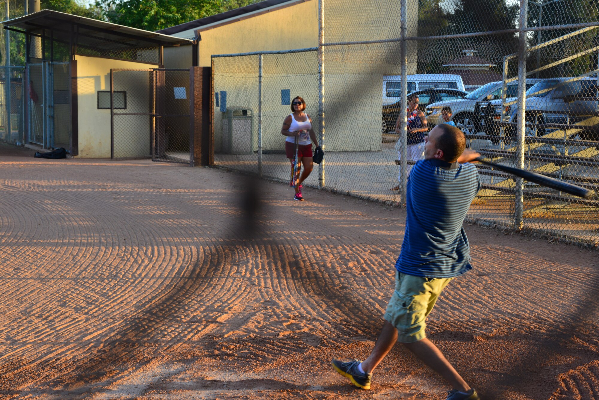 Tech. Sgt. Jody Seales, 39th Logistics Readiness Squadron, swings at a softball during the home run derby July 4, 2013, at Incirlik Air Base, Turkey. The home run derby was one of several events during the Fourth of July Celebration at Incirlik AB.  (U.S. Air Force photo by Staff Sgt. Eric Summers Jr./Released)