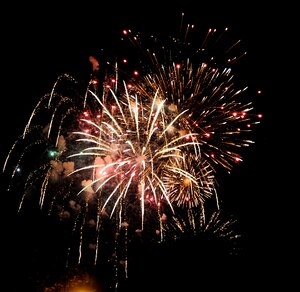 Fireworks burst into the night over the Yorktown River during the 34th annual Yorktown, Va. Fourth of July Celebration, July 4, 2013. The event also included an Independence Day 8K Run and 5K Walk, parade, bell-ringing ceremony and music from the U.S. Army Training and Doctrine Band New Orleans Jazz Ensemble. (U.S. Air Force photo by Staff Sgt. Dana Hill/Released)