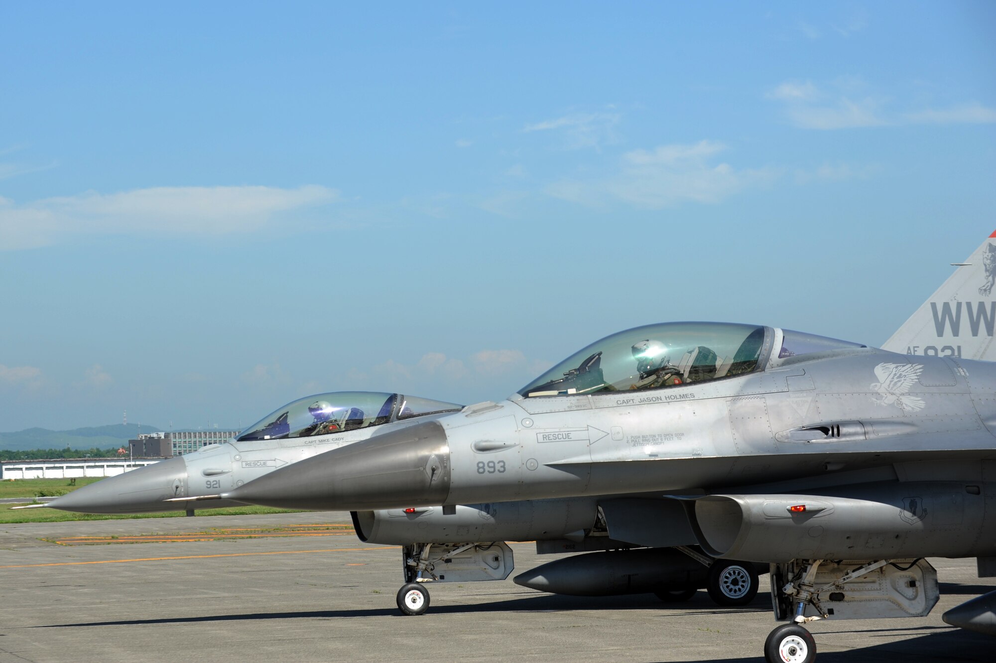 U.S. Air Force Capt. Dennis Muller, left, and 1st Lt. Michelle Hamland, both with the 13th Fighter Squadron, prepare to take off for a training combat mission with the Japan Air Self-Defense Force at Chitose Air Base, Japan, July 8, 2013. Pilots trained with each other’s forces to improve tactical air-to-air capabilities and gain more experience working with dissimilar aircraft. (U.S. Air Force photo/Senior Airman Derek VanHorn)