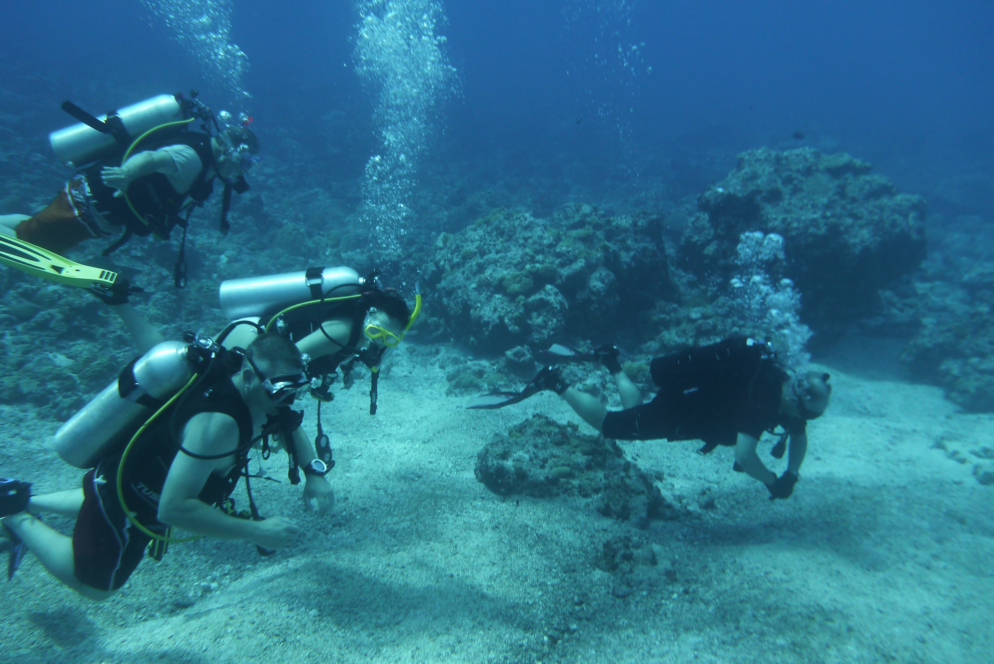 Bob Clark, 36th Force Support Squadron Andersen Family Dive Center instructor, teaches diving students during an advanced diving class in the Pacific Ocean, July 7, 2013.  With more than 75 dive spots around Guam, the Andersen Dive Center offers weekend group dives people can sign up for. (U.S. Air Force photo by Staff Sgt. Alexandre Montes/Released)