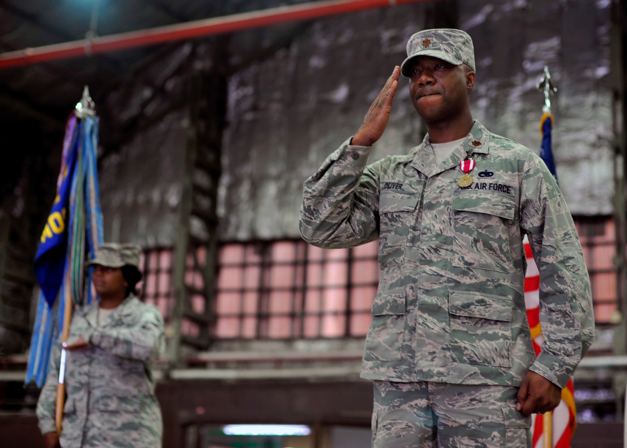 Maj. Steven Oliver, 51st Maintenance Operations Squadron, renders a final salute to the members of the 51st MOS during the squadron’s deactivation ceremony at Osan Air Base Republic of Korea, July 8, 2013. The ceremony served as a final symbol of closure for all those past and present who were a part of the 51st MOS. (U.S. Air Force photo/Senior Airman Siuta B. Ika)