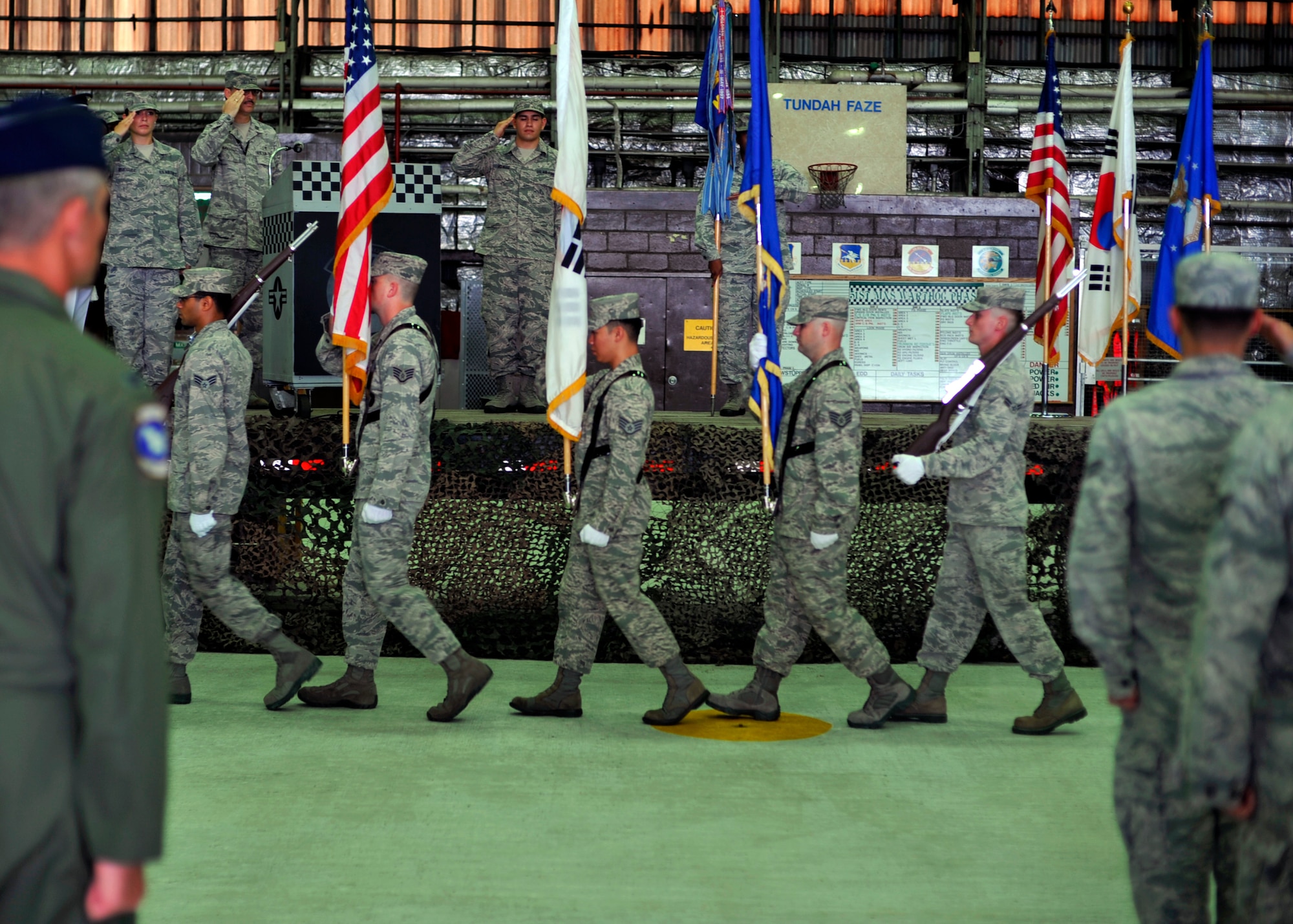 The Osan Honor Guard prepares to present the colors at the 51st Maintenance Operations Squadron deactivation ceremony at Osan Air Base, Republic of Korea, July 8, 2013. Much like a change of command ceremony, the deactivation ceremony is rooted in military history and can be traced back as far as the Roman Empire. (U.S. Air Force photo/Senior Airman Siuta B. Ika)