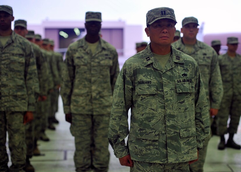 Capt. Lenard Soriano, 51st Maintenance Operations Squadron maintenance officer, leads the formation at the 51st MOS deactivation ceremony at Osan Air Base, Republic of Korea, July 8, 2013. The squadron provided critical analysis, production planning, scheduling, quality assurance oversight, weapons and maintenance training, as well as higher headquarters fleet-health reporting on behalf of the 51st Maintenance Group and the 51st Fighter Wing. (U.S. Air Force photo/Senior Airman Siuta B. Ika)
