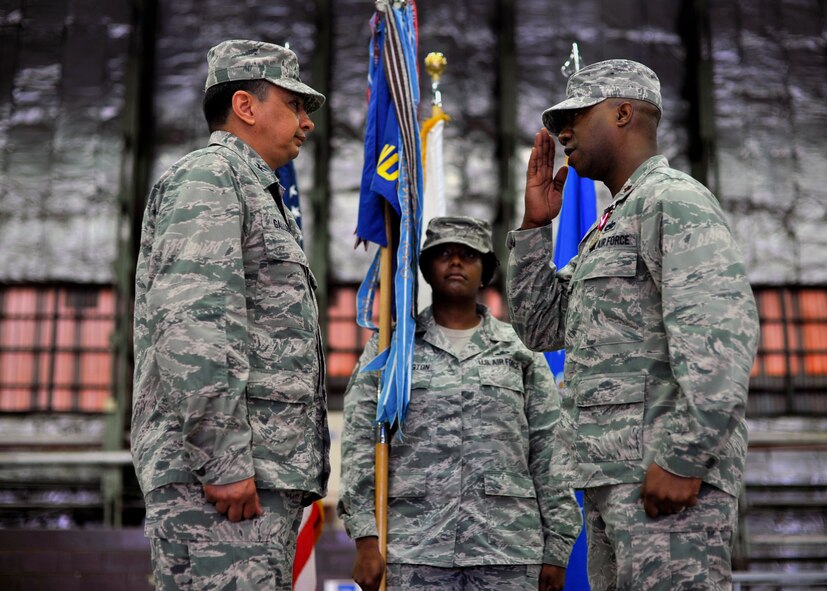 Maj. Steven Oliver (right), 51st Maintenance Operations Squadron commander, salutes Col. Luis Gallegos, 51st Maintenance Group commander, after relinquishing command of the 51st MOS during the squadron’s deactivation ceremony at Osan Air Base, Republic of Korea, July 8, 2013. Originally constituted as the 51st Station Complement Squadron in 1943, and later reconstituted and designated as the 51st Logistics Support Squadron, the squadron didn’t receive its current title until 2002. (U.S. Air Force photo/Senior Airman Siuta B. Ika)