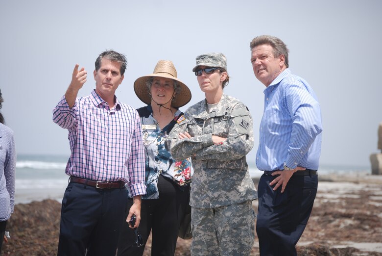 Encinitas Mayor Mike Nichols, Solana Beach Deputy Mayor Lisa Shaffer, Col. Kim Colloton and Encinitas General Manager David Ott (l to r) tour bluffs along the two coastal towns in preparation for an upcoming Civil Works Review Board presentation.