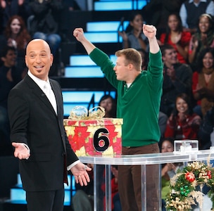 "Deal or No Deal" host Howie Mandel gestures at the camera while Staff Sgt. Matthew Zedwick looks to his on-stage guests. Zedwick said Mandel was a "pretty nice guy," and was really excited to have newlywed Zedwick and wife Kristin on the show. The two-hour Christmas special will air at 8 p.m. EST, Dec. 25.