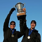 Cory Butner (left) and Vermont National Guard Pfc. John Napier (right) hoist their trophy after winning the Two-man U.S. National Bobsled Championship Jan. 4 at the Olympic Sports Complex in Lake Placid, N.Y. With the victory, the duo earned a spot in the 2009 World Bobsled Championships, scheduled for Feb. 20-March 1 in Lake Placid.