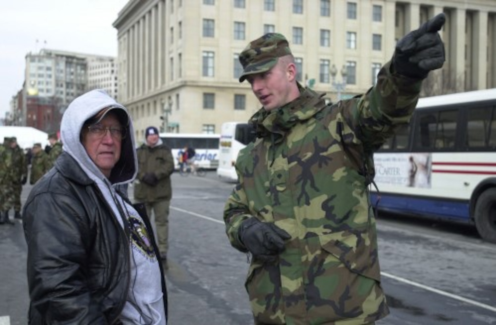 Virginia Army National Guard Spc. Jerry Andes offers directions to one of the many people who passed through a U.S. Secret Service checkpoint to watch the Inaugural Parade in Washington, D.C., on Jan. 20, 2005.