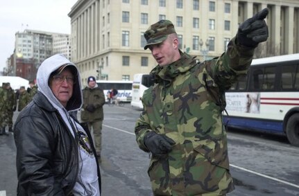 Virginia Army National Guard Spc. Jerry Andes offers directions to one of the many people who passed through a U.S. Secret Service checkpoint to watch the Inaugural Parade in Washington, D.C., on Jan. 20, 2005.