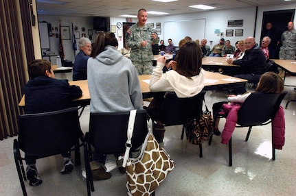 Army Col. Richard K. Knowlton, commander of the Wyoming Army National Guard's 115th Fires Brigade, talks to families at a community meeting at the armory in Douglas, Wyo., Jan. 9, 2009. Knowlton led a statewide information campaign to prepare families and business and community leaders for the largest single deployment in the state's history.