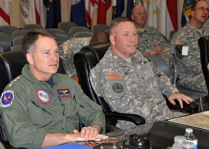 NORAD and USNORTHCOM Commander, Adm. James Winnefeld, left, is given an update briefing by the Joint Task Force North Commanding General, Army Brig. Gen. Michael A. Bills, during his visit to Fort Bliss, Texas, March 3. Topics of discussion included the task force’s on-going and future homeland security operations executed in support of the nation’s law enforcement agencies at locations throughout the USNORTHCOM area of responsibility. 

