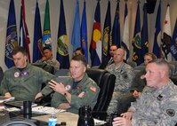 NORAD and USNORTHCOM Commander, Adm. James A. Winnefeld, Jr., center, and the Joint Task Force North Commanding General, Army Brig. Gen. Michael A. Bills, right, discuss the task force’s Defense Support to Civilian Law Enforcement Agency support operations during an update briefing March 3. JTF North coordinates military support to law enforcement agencies in order to deter and prevent transnational threats to the homeland. All military support for homeland security is based on support requests and threat assessments. 
