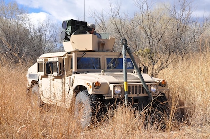 Spc. Derek Armstrong employs a Long Range Scout Surveillance System (LRAS) mounted on High Mobility Multi-Purpose Wheeled Vehicle (HMMWV). The LRAS has both day and night surveillance capabilities. The ‘Warhorse’ Cavalry Scouts reported their observations to the U.S. Border Patrol agents in the field. 

