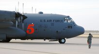 A crew chief with the 302nd Airlift Wing marshals a Modular Airborne Firefighting System-equipped C-130 in preparation for take-off at Peterson Air Force Base, Colo., April 16. Aircraft and crews from the 302nd AW have been assigned to assist the Mexican government in fighting wildland fires in Northern Mexico. The MAFFS, which is owned and maintained by the U.S. Forest Service, is a pressurized self-contained firefighting system designed for installation in C-130 aircraft without structural modifications to the aircraft. The system is designed to air-drop fire-retardant chemicals onto wildfires. 


