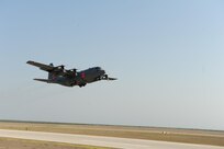 A C-130 equipped with a U.S.D.A. Forest Service Modular Airborne Fire Fighting System departs here April 17 to fight a wildfire in a neighborhood in Austin April 17. U.S. Northern Command has deployed six C-130 aircraft fitted with MAFFS to support the battle against ongoing wildfires in the area. 


