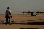 U.S. Air Force Staff Sgt. Anthony Hayes, 145th Aircraft Maintenance Squadron, North Carolina Air National Guard, prepares to refill a C-130H Hercules, equipped with the Modular Airborne Firefighting System, with fire retardant as it taxis into the pits at Dyess Air Force Base, Texas, April 19, 2011.  MAFFS is capable of dispensing 3,000 gallons of water or fire retardant in under 5 seconds.  Wildfires have spread across various parts of Texas and have burned more than 1,000 square miles of land.  (U.S. Air Force Photo/Staff Sgt. Eric Harris)