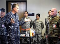 Navy Adm. James Winnefeld, North American Aerospace Defense Command and U.S. Northern Command commander, visits with participants of the National Level Exercise 2011 at Springfield-Branson National Airport in Springfield, Mo., May 18.  Winnefeld spoke with the participants of NLE to ensure that the exercise was a valuable learning experience for possible real world events. 