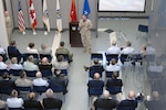 Marine Maj. Gen. Robert Walsh, U.S. Northern Command Operations Directorate director, welcomes members of the USNORTHCOM Standing Joint Force Headquarters to the Operations Directorate during the NC/SJFHQ disestablishment ceremony May 9. The NC/SJFHQ, the organization responsible for deploying the core of an emergency joint task force to contingencies across the country within six hours of mobilization, was folded into the USNORTHCOM Operations Directorate after seven years of operation as a separate directorate. 

