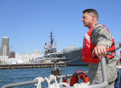 Air Force Chief Master Sgt. Allen Usry, North American Aerospace Defense Command and U.S. Northern Command Command Senior Enlisted Leader, looks across North Bay, San Diego, with the USS Midway aircraft carrier in the background during a visit to U.S. Coast Guard Station San Diego June 2. The visit was part of the 5th Annual Senior Enlisted Leadership North American Borders Conference, which brought representatives from across Northern Command, Canada Command and the National Guard together to discuss border security, joint and international activities, training and development opportunities and future activities that could affect North America. 

