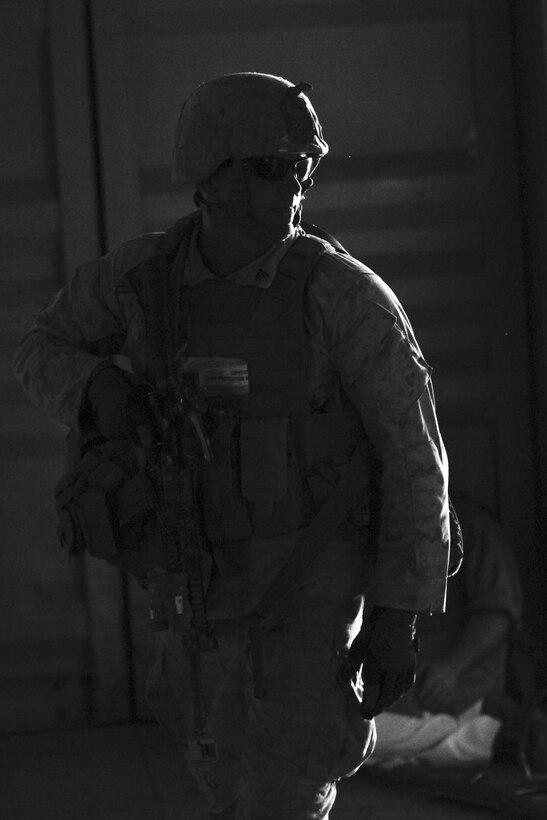 A Marine from 3rd Battalion, 1st Marine Regiment, based at Marine Corps Base Camp Pendleton, Calif., engages in close quarters battle in an urban environment during a long-range raid training exercise in the desert southeast of Marine Corps Air Station Yuma, Ariz., June 3. This raid was part of the Marine Corps’ new pre-deployment exercise – the Integrated Training Exercise.