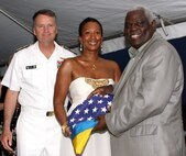 U.S. Ambassador to The Bahamas Nicole A. Avant presents the U.S. and Bahamian flags with Navy Adm. James A Winnefeld Jr., NORAD and USNORTHCOM commander, to The Hon. Kenneth Russell, The Bahamas Minister of Housing, aboard the USS Vicksburg June 30. The flag presentation served as a symbol of the bilateral friendship between the U.S. and The Bahamas and was part of the celebration observing the 235th Anniversary of Independence of the United States of America. 

