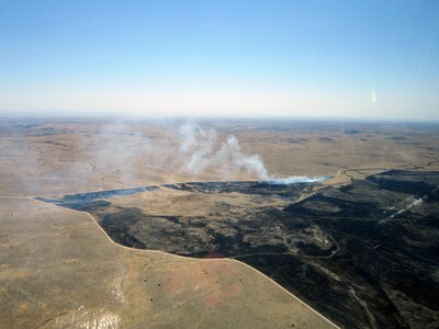 Aerial view from the crew of a Modular Airborne Fire Fighting System-equipped C-130 aircraft as they return from dropping a load of fire retardant on the Donson wildfire in New Mexico. 


