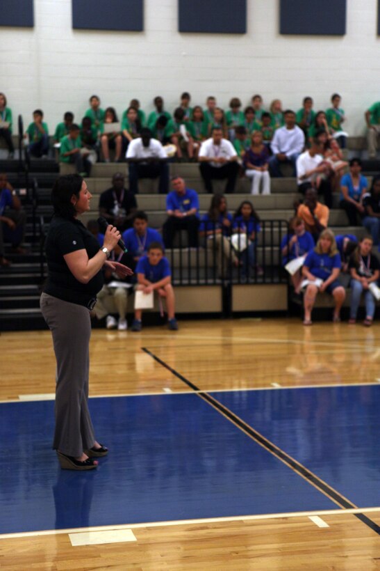 Shiana K. Barbosa, a Brewster Middle School teacher and Hoops-N-Dreams founder, thanks the crowd for their support of the program during the Hoops-N-Dreams recognition banquet at the Brewster Middle School gymnasium aboard Marine Corps Base Camp Lejeune, May 17.