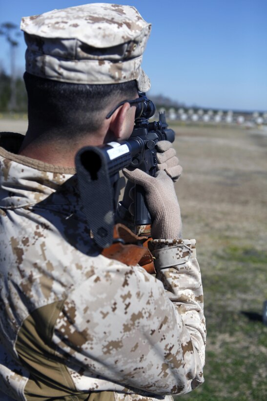 1st Lt. Joesph P. Strumolo, a competitor with Combat Logistics Regiment 25, looks through his scope at targets during the Intramural Rifle and Pistol Competition at Stone Bay's rifle and pistol ranges aboard Marine Corps Base Camp Lejeune, March 13.