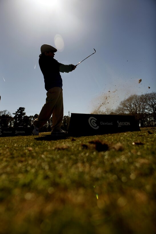 John M. Martinez, a junior golfer, practices his swing during Demo Day at the Paradise Point Golf Course driving range aboard Marine Corps Base Camp Lejeune, March 9.