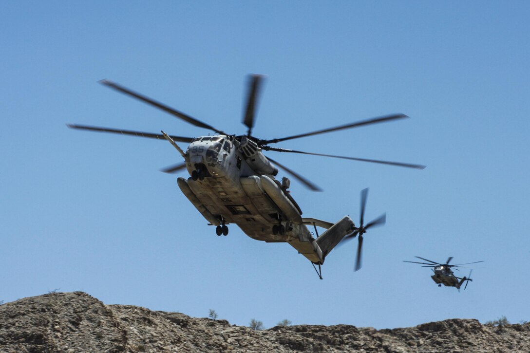 A CH-53E Super Stallion of Marine Heavy Helicopter Squadron 462, based out of Marine Corps Air Station Miramar, Calif., performs a combat landing to insert Marines from 3rd Battalion, 1st Marine Regiment, during a long-range raid training exercise in the desert southeast of Marine Corps Air Station Yuma, Ariz., June 3. This raid was part of the Marine Corps’ new pre-deployment exercise – the Integrated Training Exercise.