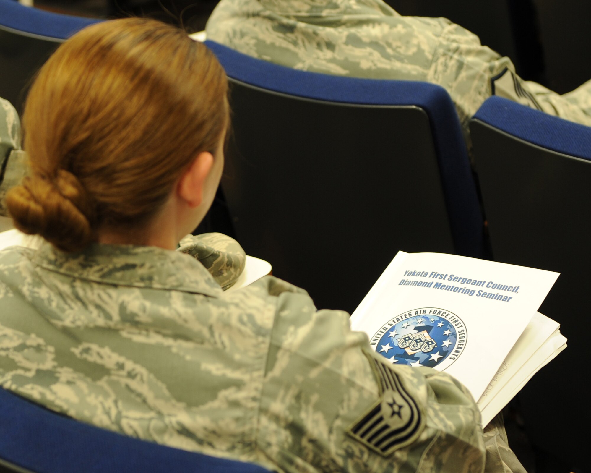 YOKOTA AIR BASE, Japan -- A technical sergeant listens during a panel discussion at Yokota’s First Sergeant Council’s Diamond Mentoring Seminar July 9, 2013, at Yokota Air Base, Japan. The seminar is held annually to teach Airmen about the role of a first sergeant. At the end of each day, a panel is held to answer any questions the attendees have. (U.S. Air Force photo by Senior Airman Desiree Economides)