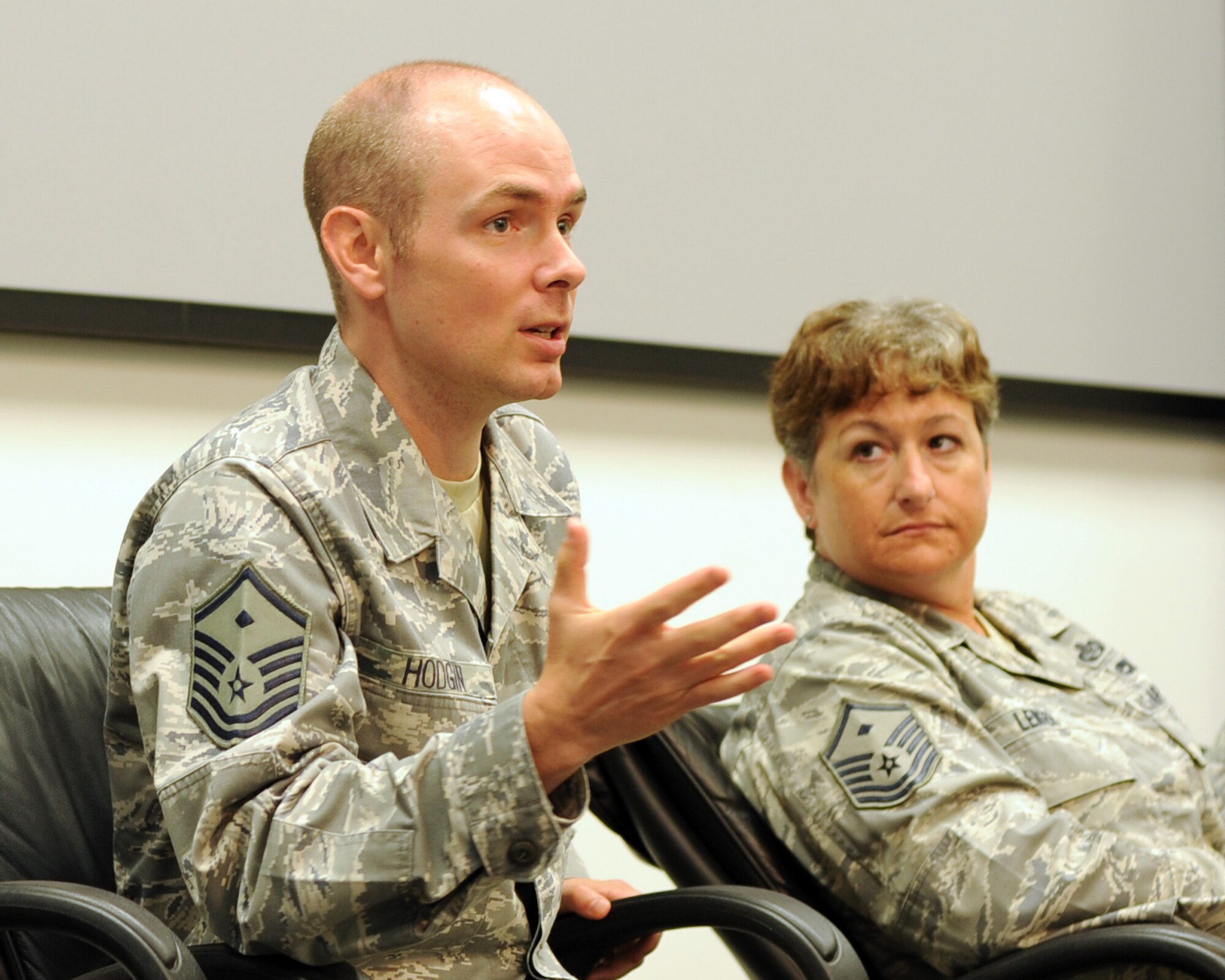 YOKOTA AIR BASE, Japan -- Right, Master Sgt. Shanti Leiker, 374th Operations Support Squadron first sergeant, observes as Master Sgt. Joshua Hodgin, 374th Security Forces Squadron first sergeant, addresses attendees during Yokota First Sergeant Council’s Diamond Mentoring Seminar July 9, 2013, at Yokota Air Base, Japan. Yokota’s First Sergeant Council utilizes the same information offered in the Air Force First Sergeant Symposium course but also identifies specific procedures unique to living overseas. (U.S. Air Force photo by Senior Airman Desiree Economides)