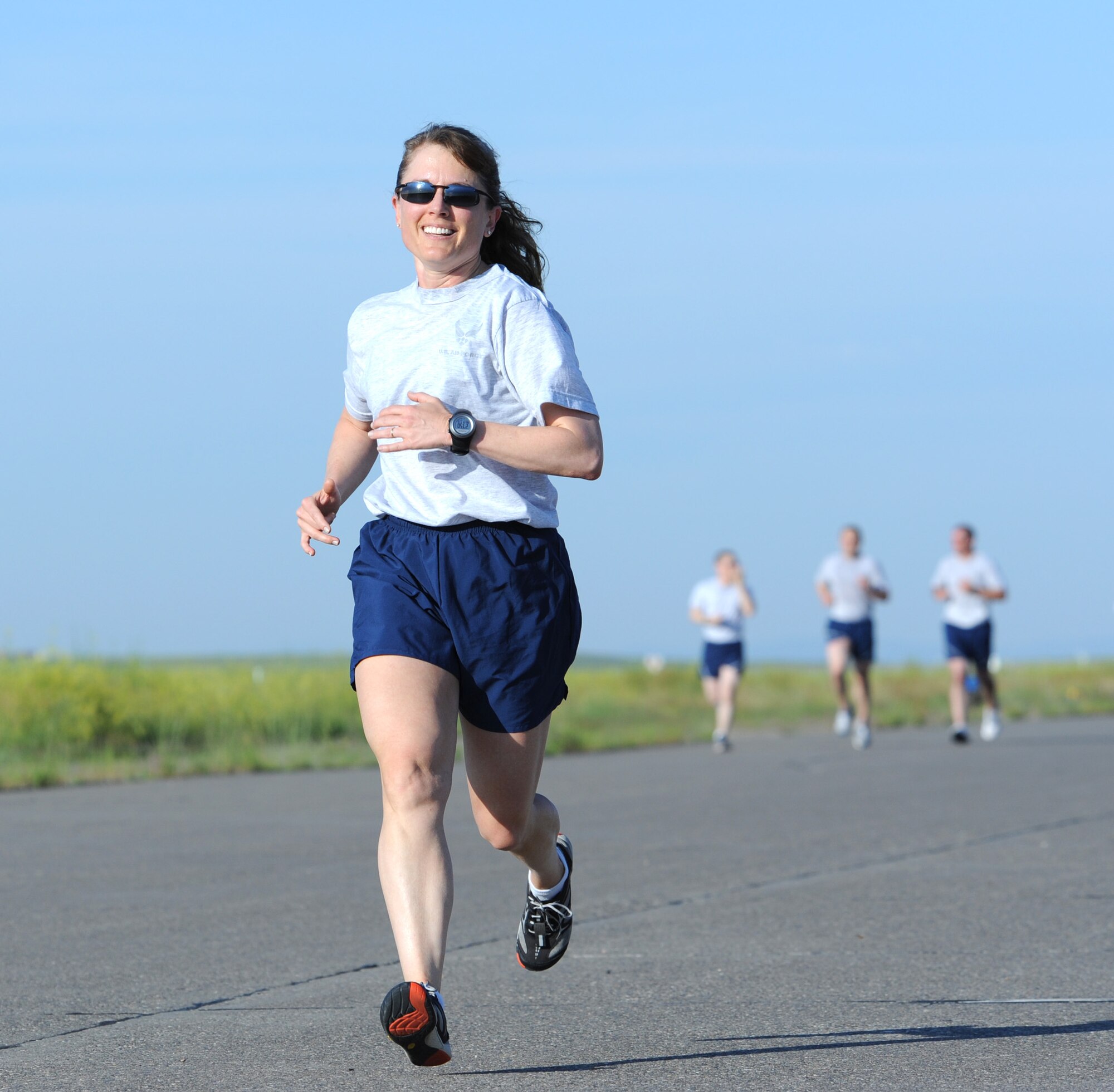 Col. Marné Deranger, 341st Missile Wing vice commander, runs to the finish of a 5K during the first of three wing runs July 3. Deranger, along with James Muscle, 341st Force Support Squadron fitness and sports director, teamed up to revamp Malmstrom’s base-wide run program. (U.S. Air Force photo/Senior Airman Katrina Heikkinen)