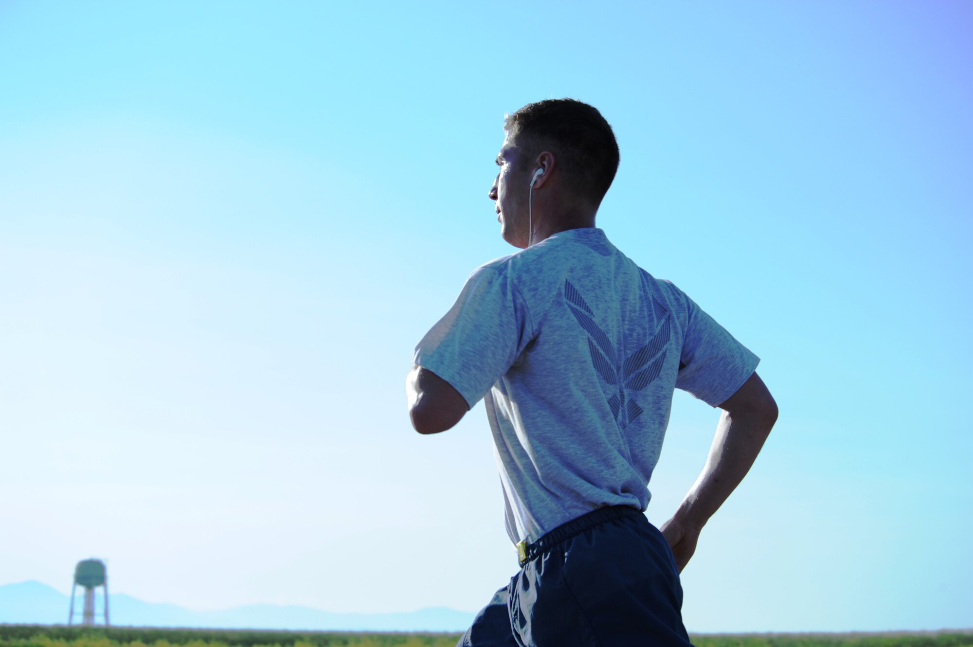 Senior Airman Peter Bilyk, 341st Comptroller Squadron financial management analyst, quickens his pace during a 5K on the Malmstrom flightline July 3. Hundreds of Airmen participated in the first wing fun run since 2011. (U.S. Air Force photo/Senior Airman Katrina Heikkinen)