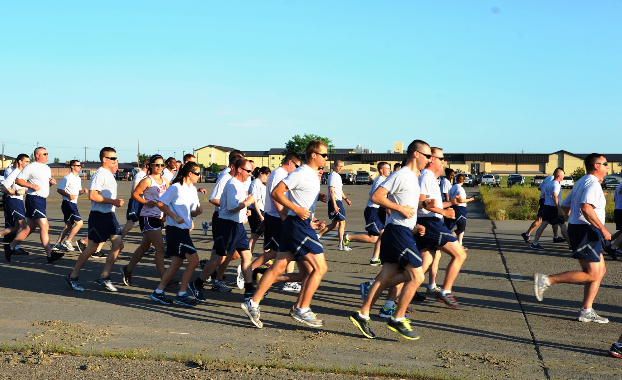 Team Malmstrom members begin running at the start of a wing run on the Malmstrom Air Force Base flightline July 3. Airmen had the option to run a 5K or 1.5-mile run. (U.S. Air Force photo/Capt. Chase McFarland)