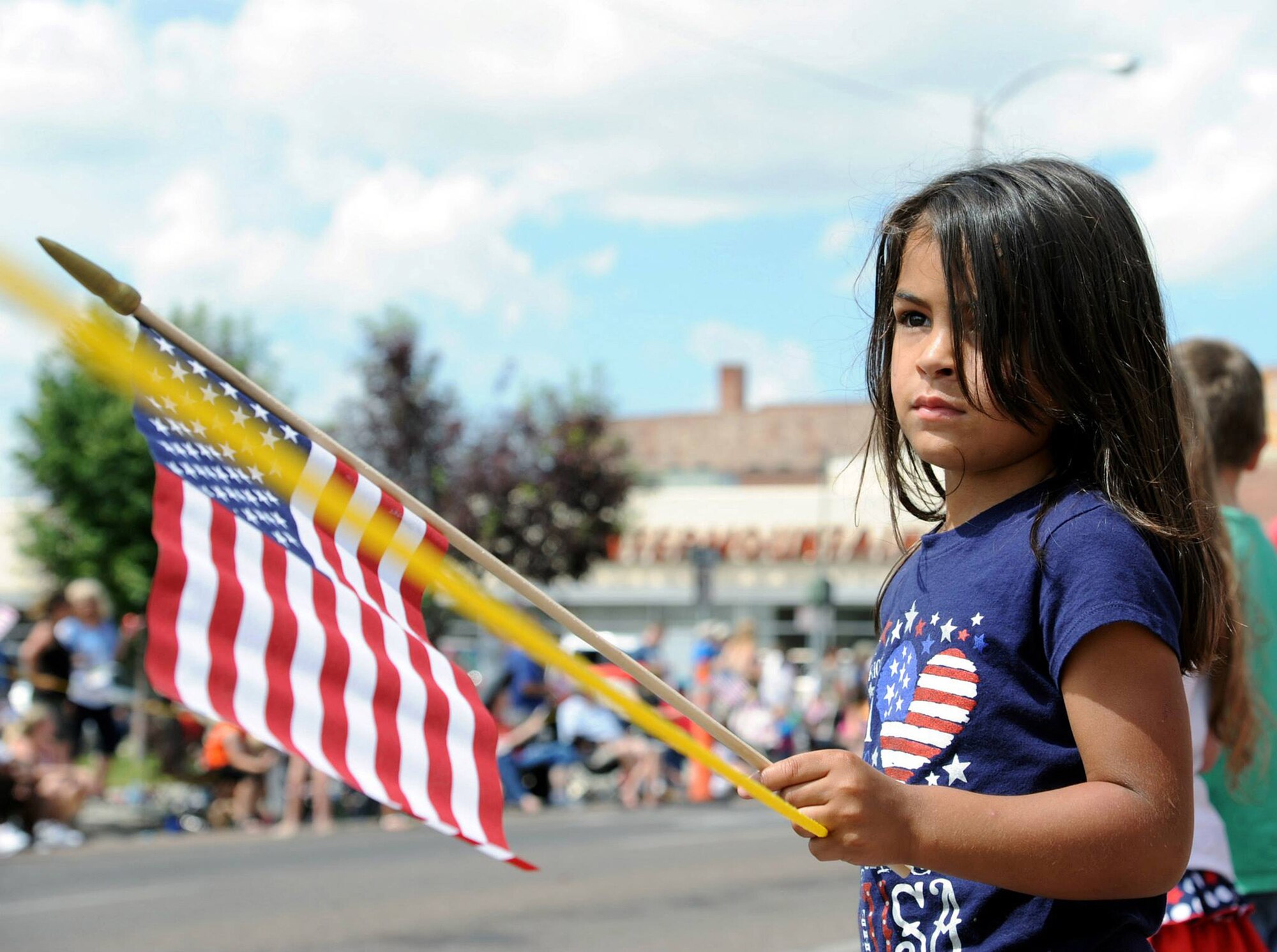Ava Salcedo, 4, daughter of Staff Sgt. Samuel Salcedo, 341st Missile Security Forces Squadron member, waves an American Flag during the Great Falls, Mont., Independence Day Parade. Thousands of local residents lined the streets of downtown Great Falls to participate in the festivities. (U.S. Air Force photo/Staff Sgt. R.J. Biermann)