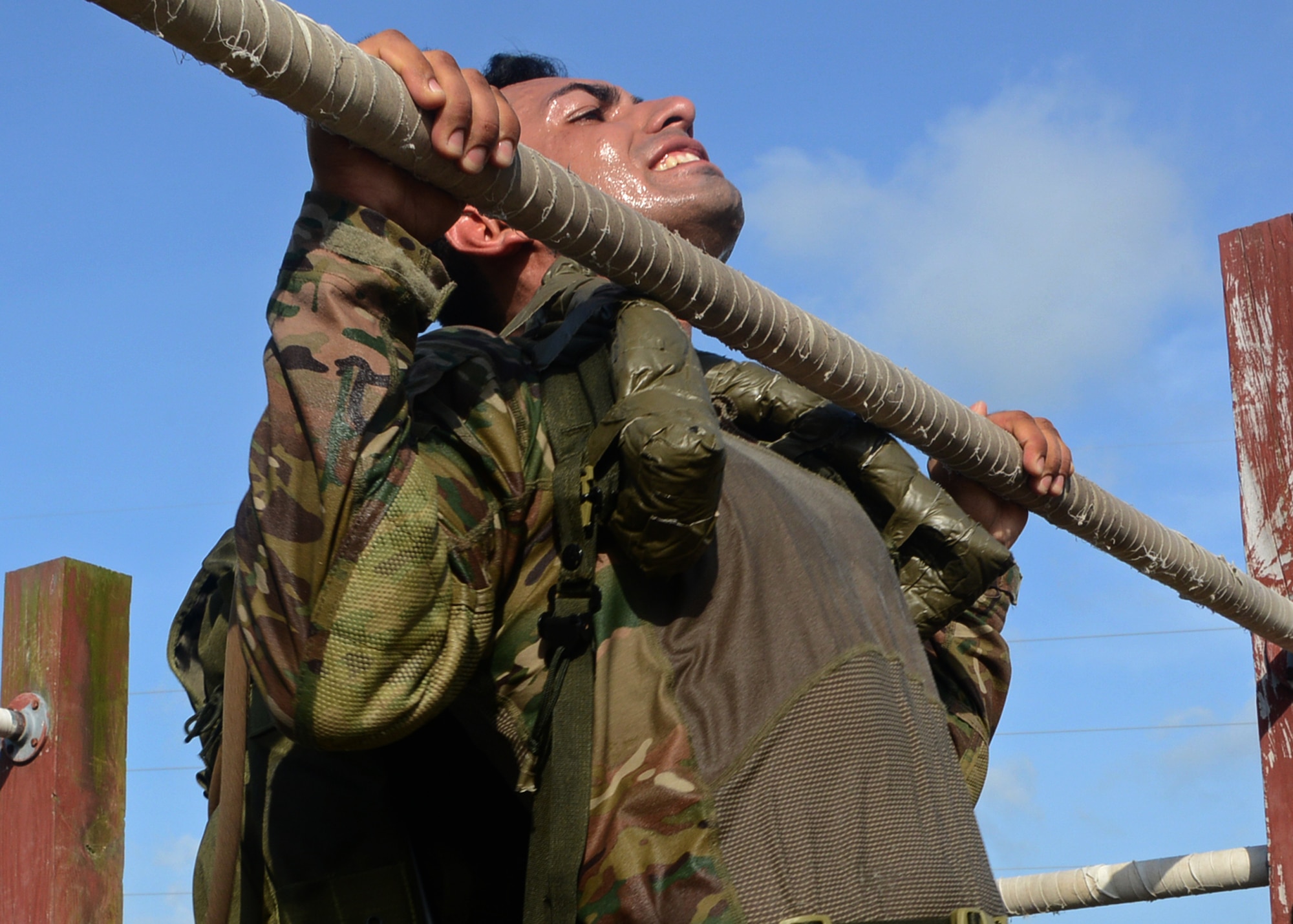 A member of the 23rd Special Tactics Squadron completes the pull-up challenge as part of a Monster Mash at Hurlburt Field, Fla., June 28, 2013. (U.S. Air Force photo by Capt. Belena S. Marquez/Released)