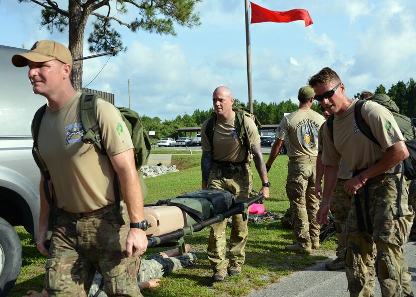 Members of the 23rd Special Tactics Squadron carry water-filled Jerry Cans for a ruck march during a Monster Mash held at Hurlburt Field, Fla., June 28, 2013. (U.S. Air Force photo by Capt. Belena S. Marquez/Released)