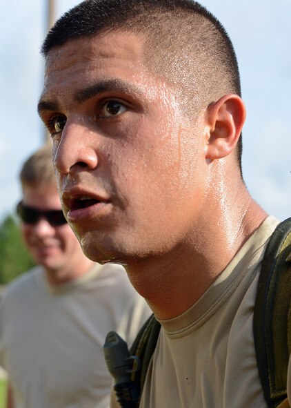 A member of the 23rd Special Tactics Squadron listens to the instructions for his next challenge during a Monster Mash held at Hurlburt Field, Fla., June 28, 2013. A Monster Mash is a competition featuring a series of training challenges such as ruck marches, marksmanship and warrior knowledge. (U.S. Air Force photo by Capt. Belena S. Marquez/Released)