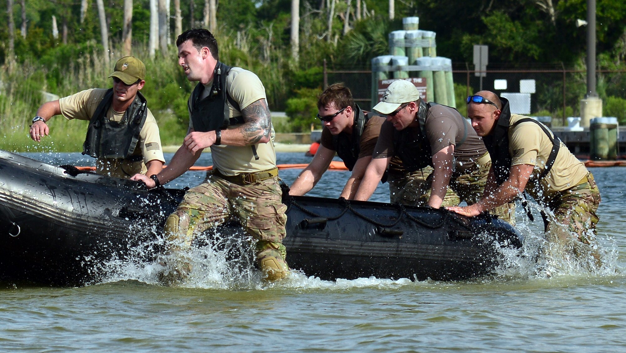Airmen assigned to the 23rd Special Tactics Squadron race into the water during a Monster Mash June 28, 2013 at Hurlburt Field, Fla. The squadron held the Monster Mash as part of their Wingman day. (U.S. Air Force photo by Staff Sgt. Melanie Holochwost)