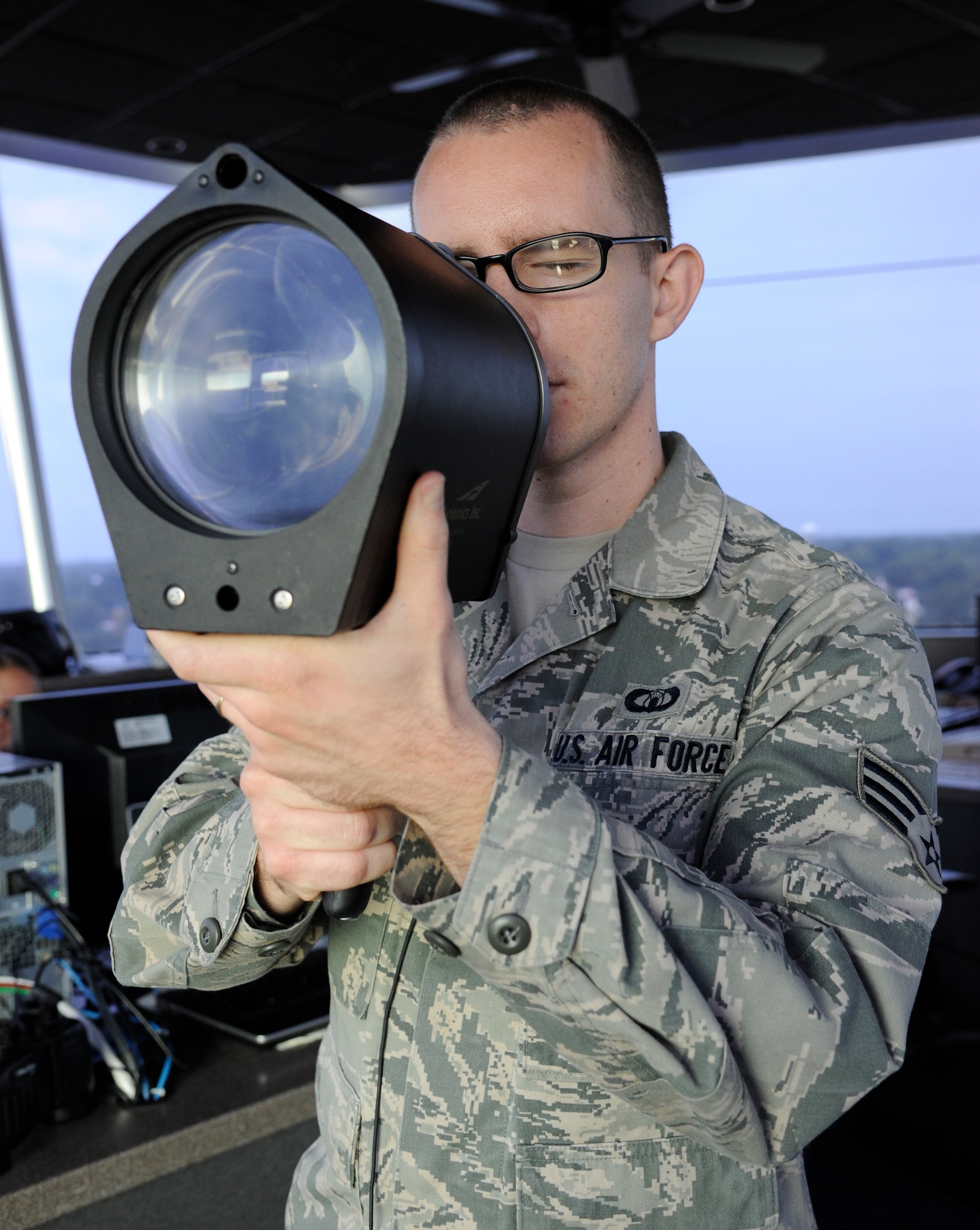 Senior Airman Anthony Scuteri, 2nd Operations Support Squadron air traffic controller, tests a light-gun on Barksdale Air Force Base, La., July 11, 2013. The light-gun is used when radio communications have failed or cannot be used, and signals air and ground crew with colored lights that signify different instructions. (U.S. Air Force photo/Airman 1st Class Andrew Moua)