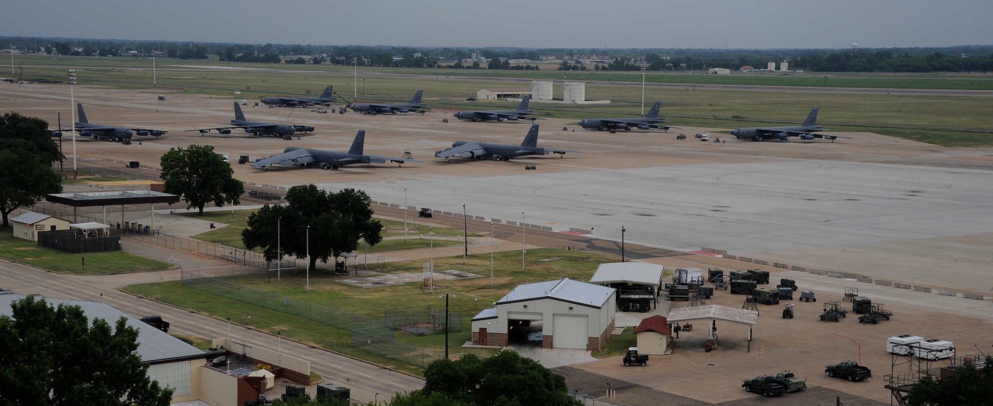 B-52H Stratofortress bombers sit on the flightline at Barksdale Air Force Base, La., July 11, 2013. Air traffic controllers guide the bombers to their parking spots on the flightline. (U.S. Air Force photo/Airman 1st Class Andrew Moua)