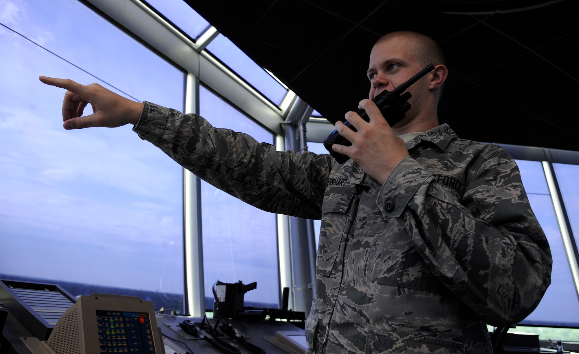 Airman 1st Class Dustin Reinhart, 2nd Operations Support Squadron air traffic controller, uses a two-way radio on Barksdale Air Force Base, La., July 11, 2013. The radio is used to communicate with ground crew such as maintainers and crew chiefs assisting in the launch of an aircraft. (U.S. Air Force photo/Airman 1st Class Andrew Moua)