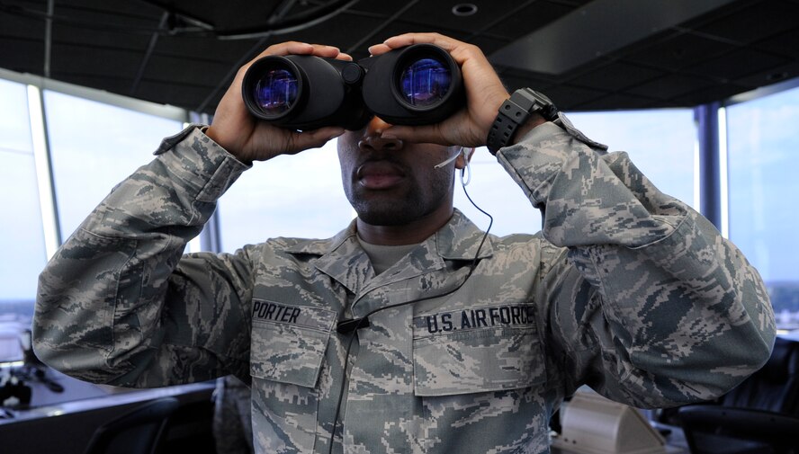Airman 1st Class John Porter, 2nd Operations Support Squadron air traffic controller, observes B-52H Stratofortress bombers on the flightline on Barksdale Air Force Base, La., July 11, 2013. Porter's duties as an air traffic controller include directing and guiding Barksdale's fleet of B-52H Stratofortress bombers, observing weather conditions and assisting in airfield management. (U.S. Air Force photo/Airman 1st Class Andrew Moua)