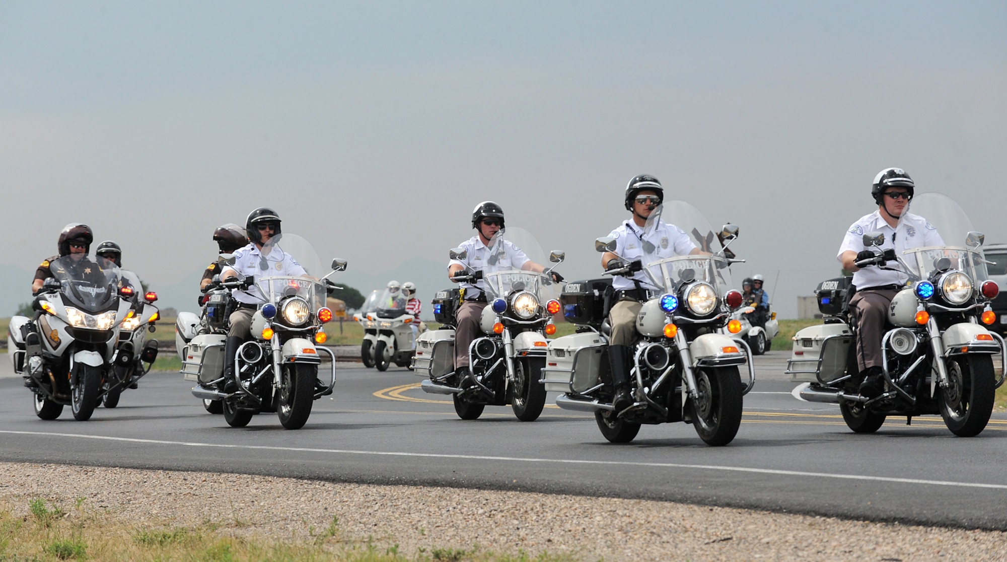 Local law enforcement and Utah Highway Patrol escorted motorcycle riders during the ‘See Me, Save Me’ campaign ride at Hill Air Force Base, Utah, July 11. The ride was went through local communities around the base and the police escorts closed intersections to ensure riders didn’t have to stop for lights during route. (U.S. Air Force photo by Alex R. Lloyd/Released)