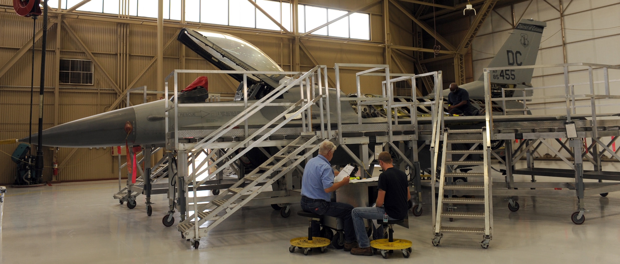 U.S. Air Force civilians from the 567th Aerospace Maintenance and Regeneration Squadron perform maintenance in the process of regenerating the first QF-16 at the 309th Aerospace Maintenance and Regeneration Group at Davis-Monthan Air Force Base, Ariz., July 9, 2013. The F-16s destined for the drone program have been in storage from three to 12 years they will complete all time compliance technical orders required for test flights during maintenance activities. (U.S. Air Force photo by Senior Airman Christine Griffiths/Released)